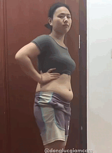 Woman demonstrating her outfit and silhouette