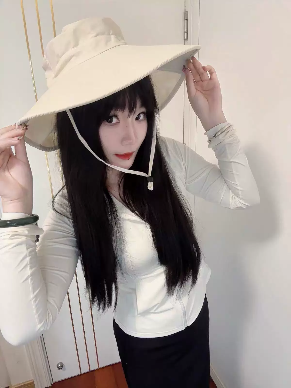 ນາງແບບໃສ່ຫມວກ