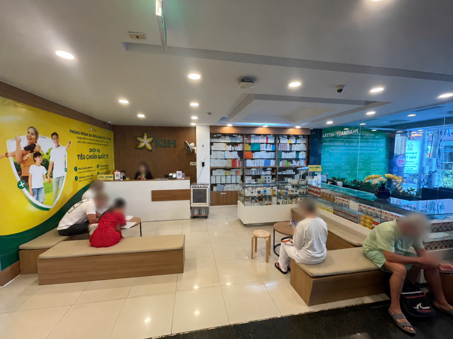 KIH clinic reception and waiting area, visitor faces blurred