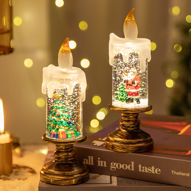 Two LED candles glowing side by side at night